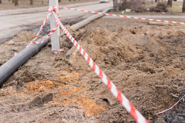 istock Plastic pipes in the ground during construction on the street 1388443377