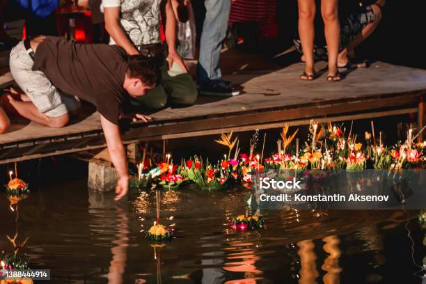 Local People And Tourists Celebrate Loy Krathong By Releasing Ritual Vessel Or Lamp To Float In Sea Traditional Thai Festival Stock Photo - Download Image Now