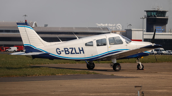 Leeds Bradford Airport, United Kingdom,  24 March, 2022: Piper PA28-161 (G-BZLH) parked up.