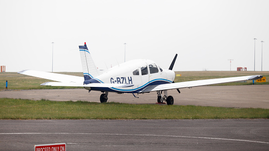 Leeds Bradford Airport, United Kingdom,  24 March, 2022: Piper PA28-161 (G-BZLH) parked up.
