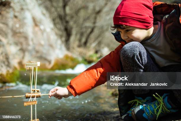 A Kid Learning About Sustainable Energy Stock Photo - Download Image Now - Water Wheel, Child, 8-9 Years