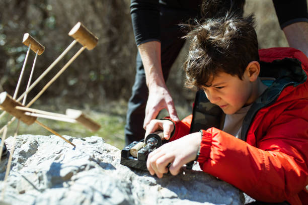 istock A cute boy and his dad making a waterwheel 1388446424