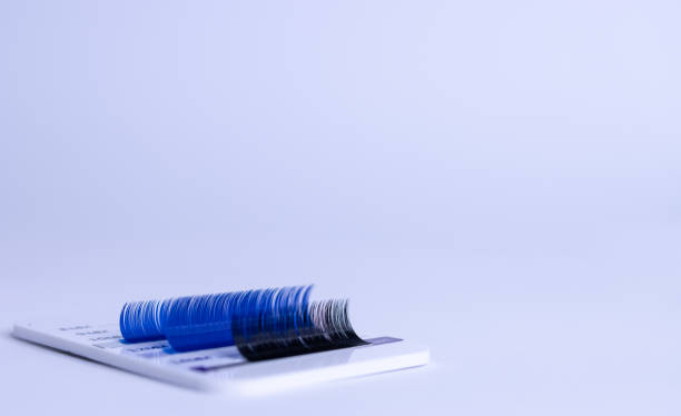 istock Artificial eyelashes for eyelash extensions. Black and blue eyelashes 1388447283