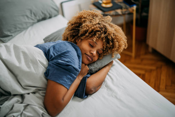 istock Beautiful Woman Sleeping in her Bedroom 1388450664