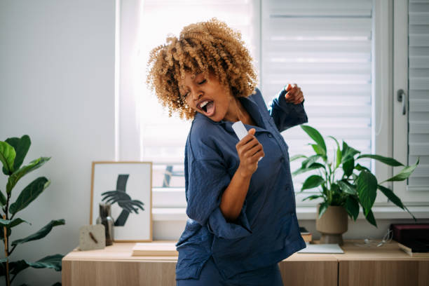 istock Happy Woman Having Fun in her Bedroom 1388450690