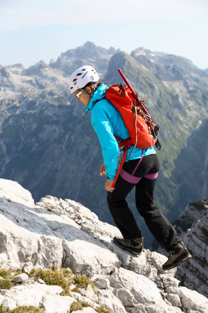 istock Young woman climbing mountains close-up 1388451642