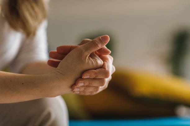 Copy space shot of unrecognizable woman cracking her knuckles while anxious stock photo