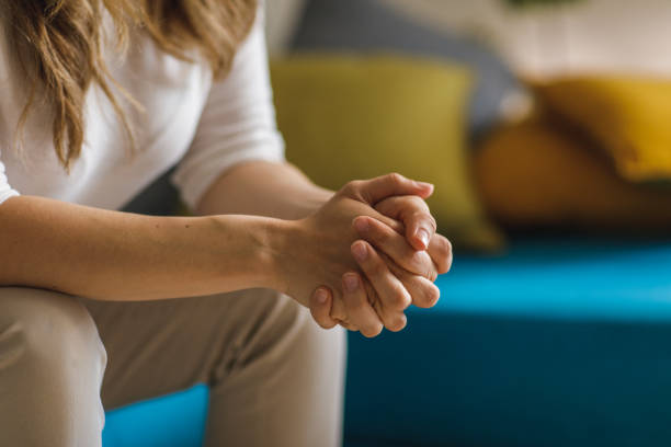 istock Copy space shot of unrecognizable woman sitting with hands clasped 1388452952