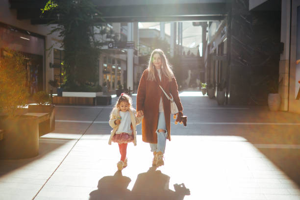 istock Happy mother and daughter shopping 1388462062