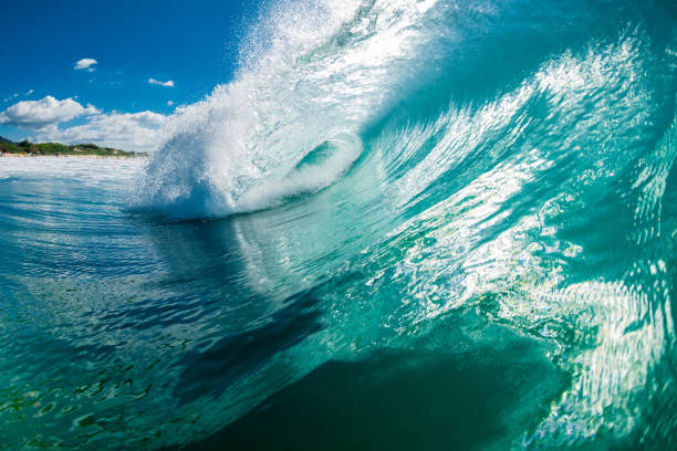 istock Turquoise beach break waves in ocean. Breaking wave with sunshine 1388462702