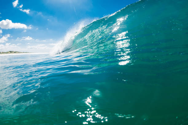 istock Turquoise beach break waves in ocean. Breaking wave with sunshine 1388462707