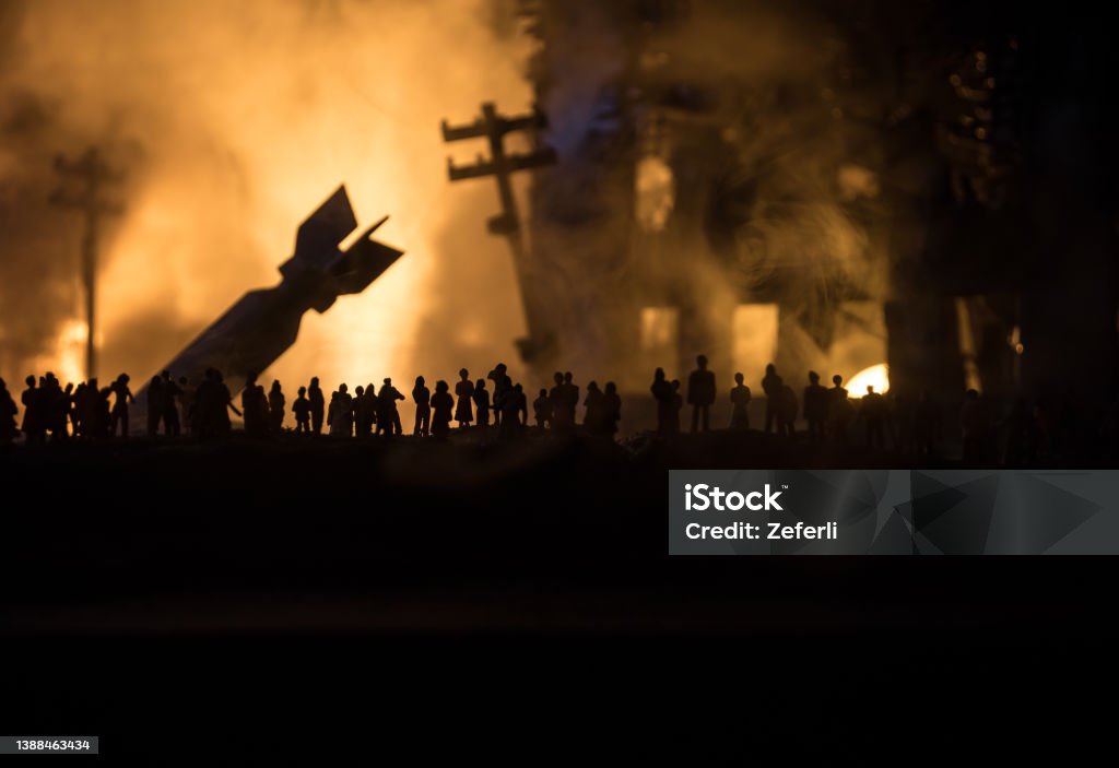 Creative artwork decoration war on Ukraine. Crowd looking on giant explosion and attacking soldiers. Creative artwork decoration - Russian war in Ukraine concept. Crowd looking on giant explosion of city buildings. Selective focus War Stock Photo