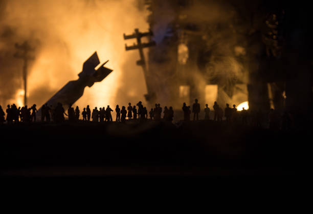 Creative artwork decoration war on Ukraine. Crowd looking on giant explosion and attacking soldiers. Creative artwork decoration - Russian war in Ukraine concept. Crowd looking on giant explosion of city buildings. Selective focus mariupol stock pictures, royalty-free photos & images
