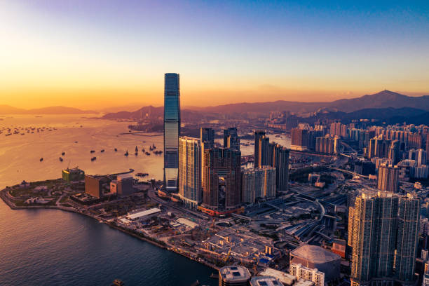 Sunset photo of the Hong Kong skyline and Victoria Harbor from drone Sunset photo of the Hong Kong skyline and Victoria Harbor from drone kowloon stock pictures, royalty-free photos & images