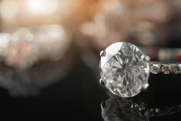 istock Beautiful diamond rings jewelry background 1388469086