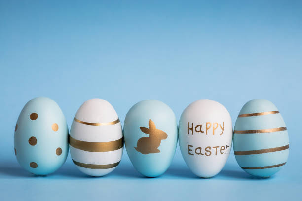 istock Easter painted eggs isolated on trendy blue background. The minimum concept. Card with copy space for text. 1388469636