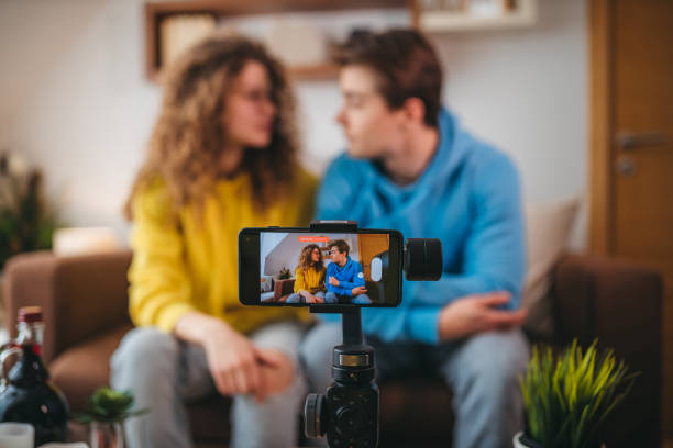 istock Influencer recording at home with his girlfriend 1388470415