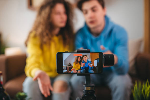 istock Influencer recording at home with his girlfriend 1388470424