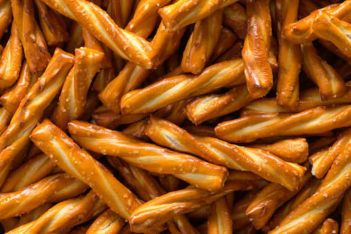Pile of Twisted Pretzels Background Close Up.