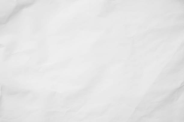 istock White recycled craft paper background. Abstract grey material texture old vintage page, grunge vignette of newspaper sheet. Pattern rough parchment crease grunge letter with copy space for text. 1388487528