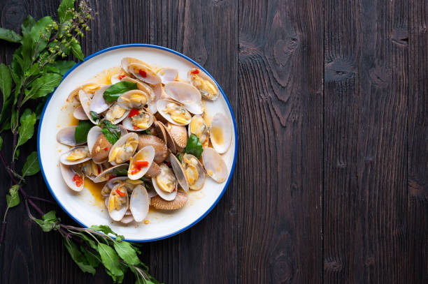 istock Stir fried Spicy Clam (Surf clam, Short necked clam, Carpet clam, Venus shell, Baby clam) with Thai Holy Basil 1388488450