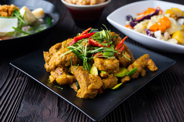 istock Stir Fried Pork Ribs Red Curry Paste And Coconut Milk. 1388488524