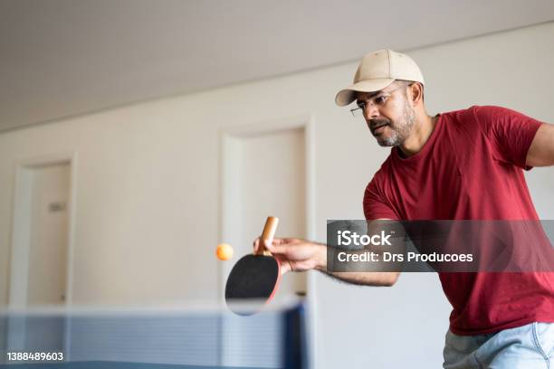 Playing Ping Pong Stock Photo - Download Image Now - Table Tennis, Lifestyles, Exercising