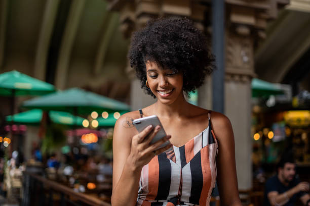 istock Portrait of woman using cellphone 1388489615