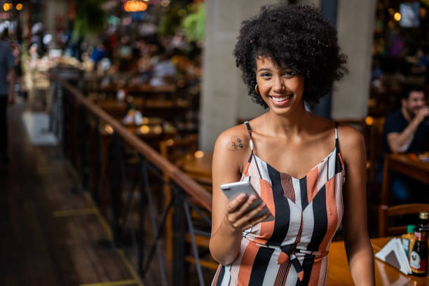 istock Portrait of woman using cellphone 1388489616