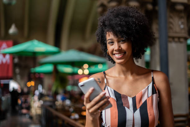 istock Portrait of woman using cellphone 1388489617