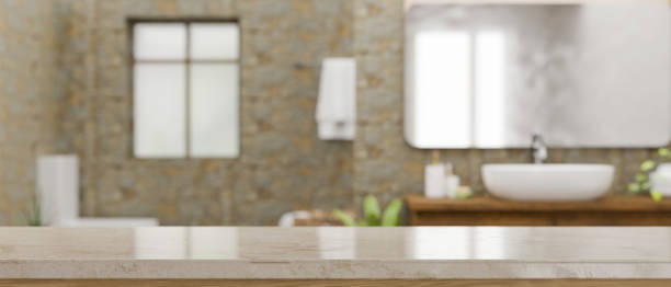 istock Empty space on marble bathroom countertop over blurred modern stone bathroom 1388489651