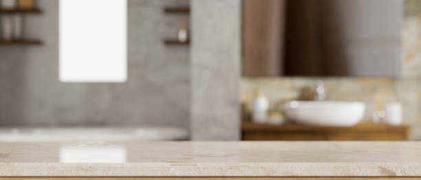 istock Mockup space for montage on marble bathroom tabletop over blurred stylish bathroom 1388489678