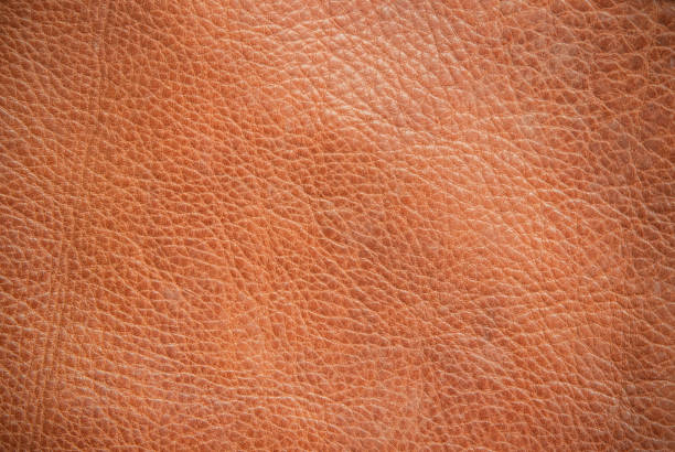 istock Genuine leather texture background. Dark brown, orange textures for decoration blank. Vintage skin natural suede with design line pattern or red abstract can use wallpaper or backdrop luxury event. 1388493099
