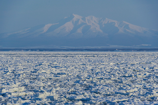 Mt. Shari seen from the sea filled with drift ice