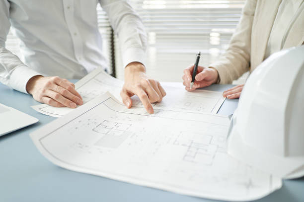 istock Asian architect having an architectural meeting 1388495010