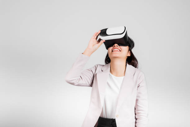 istock Smiling woman confidence excited wear VR headset device during virtual reality experience 1388495034