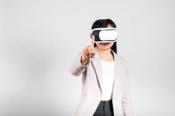 istock Smiling woman confidence wearing VR headset device touching air during virtual reality experience 1388495102