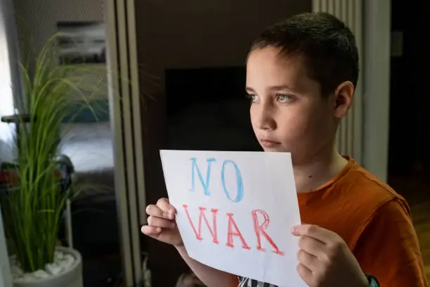 Photo of A Child against War. Family, patriotism, unity, support, crisis, war.