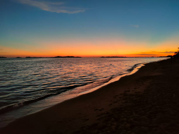 istock Sunset on the horizon at the beautiful sandy beach. 1388498678