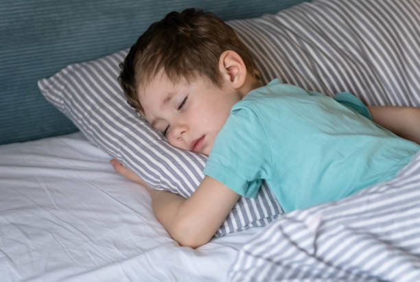 istock Little baby napping in the nursery. Closeup boy sleeping peacefully. 1388498679