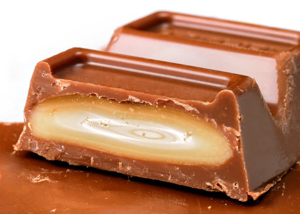 Chocolate candy stuffed with caramel jelly. Close-up chocolate bar.