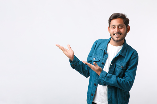 Man raising arm and waving friendly, isolated handsome man saying hi, friendly face man saying goodbye, concept of man saying hi on isolated background