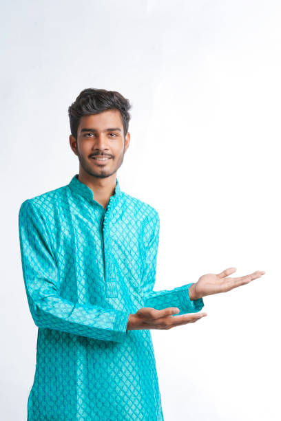 istock Indian man in tradition wear and giving expression on white background. 1388500746