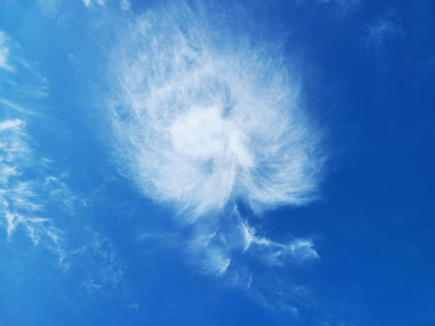 Blue skies and clouds of unusual shapes. stock photo