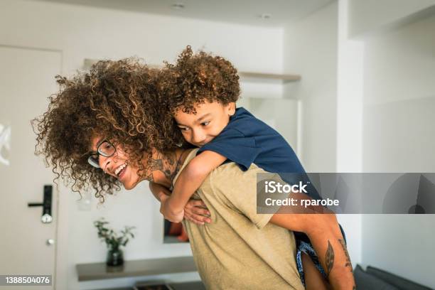 Nonbinary Person Playing With Child Stock Photo - Download Image Now - Non-Binary Gender, Parent, Child