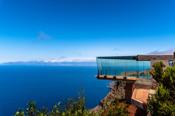 Abrante Viewpoint in La Gomera, Canary Islands Agulo, Spain - August 9, 2021: Abrante Viewpoint. It has a famous walkway with a glass floor facing Teide Volcano agulo stock pictures, royalty-free photos & images