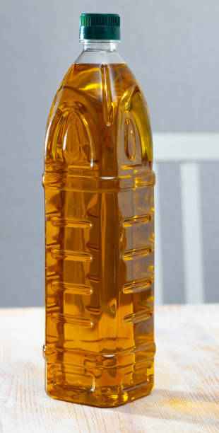 istock Vegetable oil on wooden table 1388509464