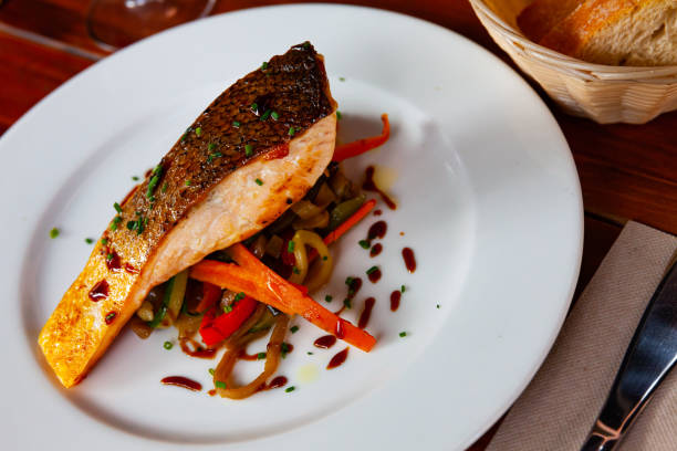 istock Grilled salmon with sauteed vegetables 1388509469