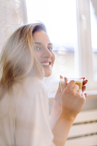 istock Beautiful woman with morning coffee 1388510736