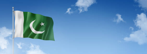 istock Pakistani flag isolated on a blue sky. Horizontal banner 1388510792